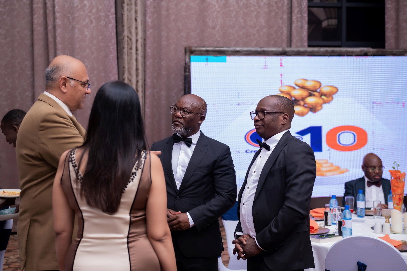 (L-R) Mr Jayesh Patel and Mrs Patel, of Nationwide Marketing Limited interact with Thoko Mkavea, Deputy Chief Executive officer and Benison Jambo, Chief Business Development Officer for CDH Investment Bank at the Lilongwe gala dinner