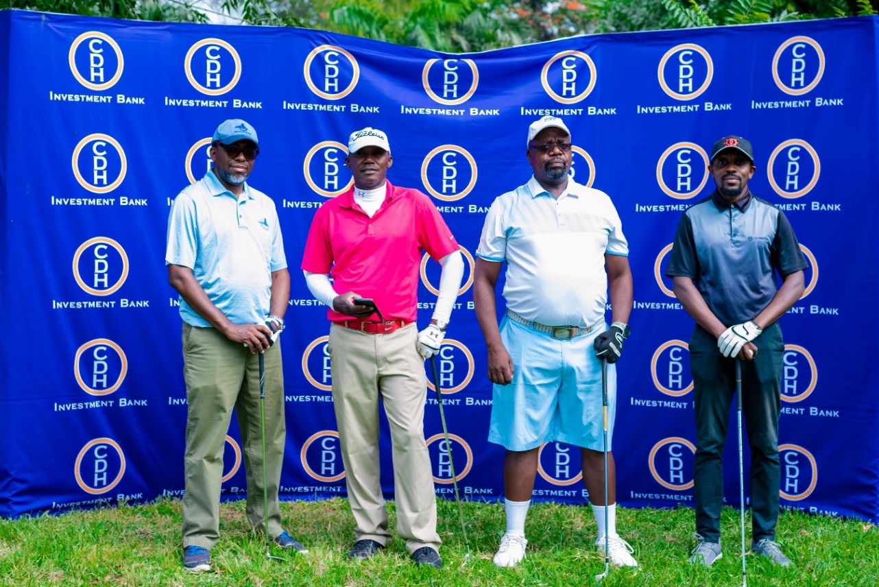 In the picture: Team 2 of Mr Bernard Ndau (2nd Right) and Mr Fanuel Nkhono (left) who represented CDH Investment Bank at the golf tournament