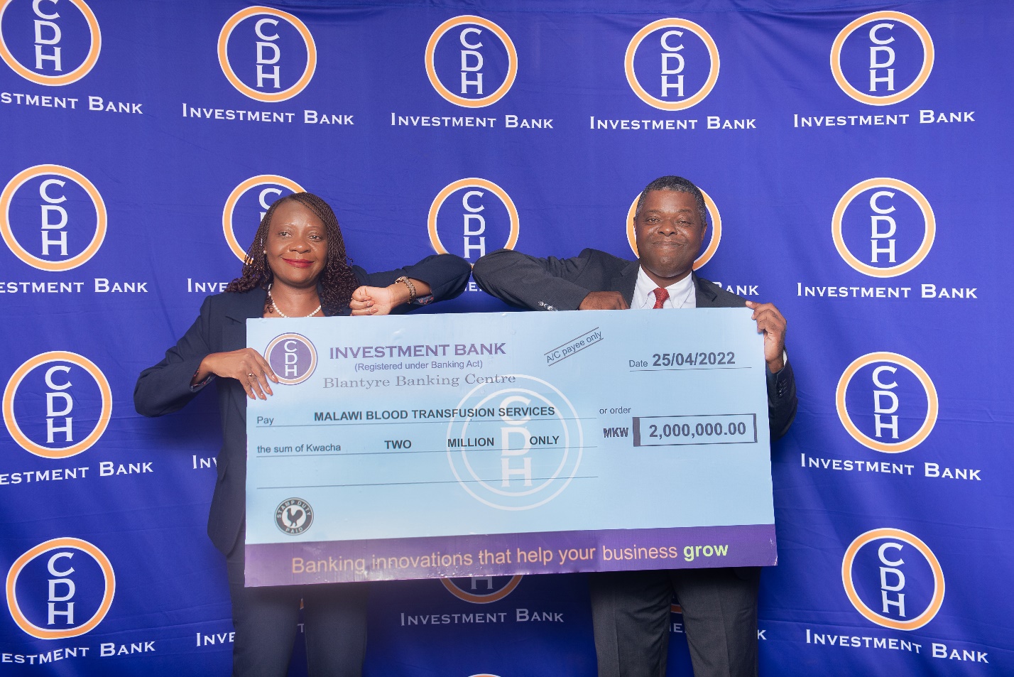 In the picture: CDH Investments Bank Chief Operationg Officer Mr James Chikoti (R) handing over a symbolic cheque to Malawi Blood Transfusion Services Chief Executive Officer Mrs Natasha Nsamala. 