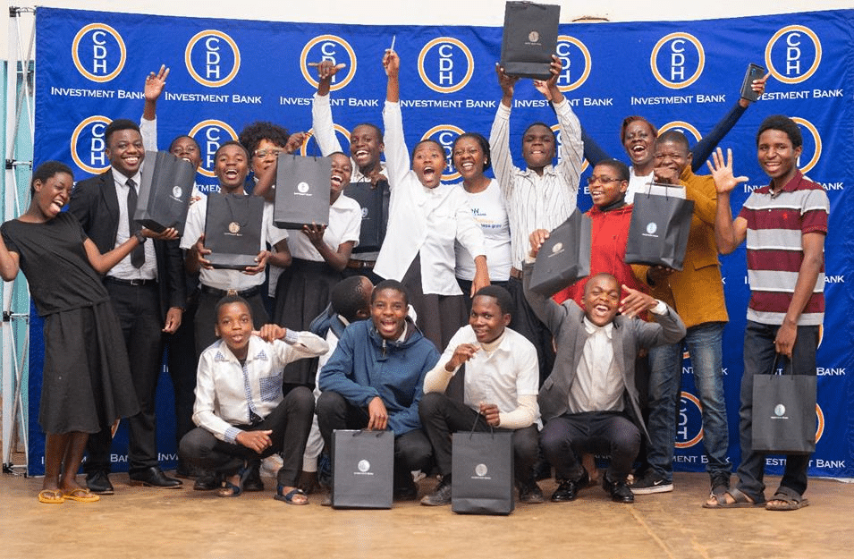 CDH Investment Bank Staff and students of Thyolo Secondary School celebrate the global money week in Thyolo, Malawi