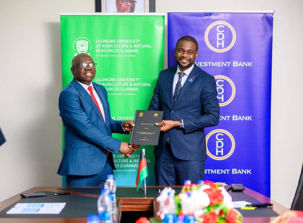 CDH Professor Emmanuel Kaunda (L) and Mr Jamal Kamoto (R) shake hands after successfully signing the
2026-2028 memorandum of understanding