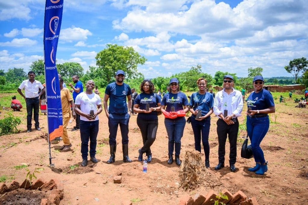 CDH Investment Bank members of staff plant trees at Mlewa Primary School in Lilongwe